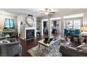 Spacious living room with a fireplace, open floor plan, and modern decor at 7628 Summer Berry Ln, Lithonia, GA 30038