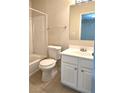 Bathroom featuring a shower-tub combo and vanity with ample storage space at 2104 Meadow Peak Rd, Duluth, GA 30097