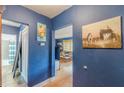 Apartment hallway showing bathroom entrance and view of living room in unit at 1705 Monroe Ne Dr # D05, Atlanta, GA 30324