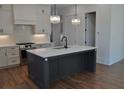 Beautiful kitchen featuring a large island with white countertop and stainless steel appliances at 297 White St # 1, Marietta, GA 30060