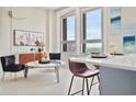 Bright living room with large windows, modern decor, and city view at 20 Marietta Nw St # 15D, Atlanta, GA 30303
