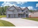 Beautiful two-story home featuring a spacious driveway and three-car garage at 37 Deer Canyon Dr, Auburn, GA 30011