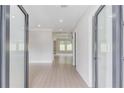 Open foyer with hardwood floors and views into the living area at 37 Deer Canyon Dr, Auburn, GA 30011