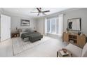 Serene main bedroom with ceiling fan, neutral tones, and ample natural light at 13 Ivy Ne Sq, Atlanta, GA 30342