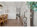 Bright entryway featuring wood floors, a console table, and views of the living room at 701 Woodward Ct, Canton, GA 30114