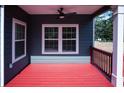 Cozy outdoor space with a painted wood porch, stylish railings and ample sunlight at 102 Neal Ave, Stockbridge, GA 30281