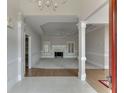 Elegant home foyer with tile flooring, decorative pillars, and an open view to the living space at 1125 Lewis Ridge Cir, Lawrenceville, GA 30045