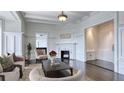 Bright living room with decorative molding, fireplace, and hardwood floors at 75 Ponce De Leon Ne Ave # 403, Atlanta, GA 30308
