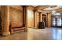 Elegant lobby with marble walls, decorative columns, a cozy bench, and an inviting reception area at 75 Ponce De Leon Ne Ave # 403, Atlanta, GA 30308