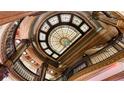 Breathtaking view of a multi-story stained glass ceiling with wrought iron railing at 75 Ponce De Leon Ne Ave # 403, Atlanta, GA 30308