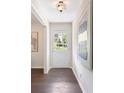 Bright entryway featuring hardwood floors and a stylish front door at 3131 Garden Lane Dr, Marietta, GA 30062