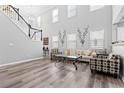 Bright living room with two story ceilings, lots of natural light, and modern furnishings at 930 Silver Lake Dr, Acworth, GA 30102