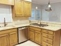 Kitchen featuring stainless steel appliances, granite countertops, and ample cabinet space at 11575 Wildwood Springs Dr, Roswell, GA 30075