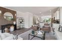 Cozy living area with wood accent wall, comfortable seating and decor at 208 College Cir # 1008, Hapeville, GA 30354