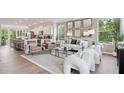 Open-concept living room with seamless flow, stylish seating, and modern decor at 208 College Cir # 1008, Hapeville, GA 30354