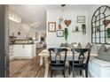 Bright dining area featuring built-in bench seating, stylish decor, and open access to the modern kitchen and living spaces at 1304 Liberty Nw Pkwy # 1610, Atlanta, GA 30318