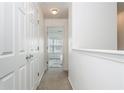 Bright hallway leads to a bedroom filled with natural light at 1304 Liberty Nw Pkwy # 1610, Atlanta, GA 30318