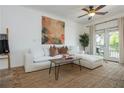 Bright living room with a comfortable sofa, stylish decor, and access to a private balcony at 1304 Liberty Nw Pkwy # 1610, Atlanta, GA 30318