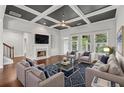 Bright living room with a fireplace, coffered ceilings and lots of natural light at 2335 Plummer Sw Pl, Marietta, GA 30064
