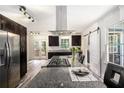 The spacious kitchen island features granite countertops, stainless steel appliances, and a modern design at 2674 Skylane Dr, Marietta, GA 30062