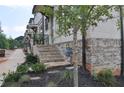 Side view of townhome exteriors with brick stairway and base at 289 White St # 3, Marietta, GA 30060