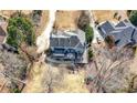 Aerial view of a large property with a deck, patio, and backyard play area at 3819 Trotters Run, Douglasville, GA 30135