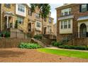 Manicured lawn in front of brick townhomes at 4202 Morrison Way # 9, Atlanta, GA 30341