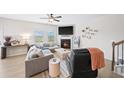 Bright living room featuring a fireplace and comfortable seating area at 191 Madison Bnd, Woodstock, GA 30188