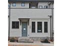 Charming townhouse exterior with brick accents, gray paint, and trimmed windows and door with covered entry at 285 White St # 4, Marietta, GA 30060