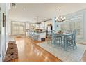 Open-concept kitchen and dining area with hardwood floors and natural light at 5029 Rosalie Rd, Johns Creek, GA 30022