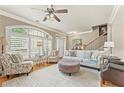 Bright and airy living room with hardwood floors, arched windows, and comfortable seating at 5029 Rosalie Rd, Johns Creek, GA 30022