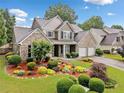 Attractive two-story home with brick, well-maintained landscaping, and an attached two-car garage at 977 Frog Leap Trail Nw, Kennesaw, GA 30152