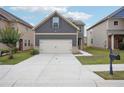 Charming two-story home with a two car garage, landscaped front yard and craftsman style accents at 2493 Oakleaf Rdg, Lithonia, GA 30058
