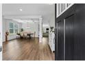 Bright, open-concept dining room with hardwood floors and abundant natural light at 49 Ryder Pass Way, Loganville, GA 30052