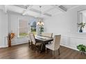 Elegant dining room featuring a modern chandelier, trim accents and a large window at 49 Ryder Pass Way, Loganville, GA 30052