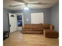 Cozy living room featuring hardwood floors and a comfortable couch at 497 Prince Of Wales, Stone Mountain, GA 30083