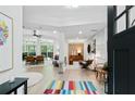 Inviting home entryway with a colorful rug, modern decor, and open floor plan at 2349 Echo Cliff Ne Ct, Atlanta, GA 30345