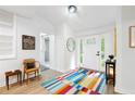 Bright entryway features light floors, a colorful rug, and a view into the bathroom at 2349 Echo Cliff Ne Ct, Atlanta, GA 30345
