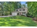 Well-manicured lawn leads up to this two-story home with a welcoming red front door at 4378 Heritage Glen Ct, Marietta, GA 30068
