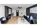 Bright living room featuring modern decor, sleek black accents, and stylish furnishings at 445 Westmeath Sw Dr, Atlanta, GA 30310