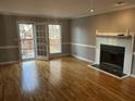 Spacious living room with a fireplace and hardwood flooring at 3808 Holy Cross Ct, Decatur, GA 30034