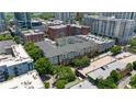 An aerial view of the complex highlighting nearby building, greenery, and parking at 800 Peachtree Ne St # 1504, Atlanta, GA 30308