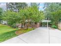 This home boasts a spacious driveway with a carport, perfect for protecting your vehicles from the elements at 2889 Mount Olive Dr, Decatur, GA 30033
