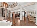 Grand foyer with wood floors, staircase with iron spindles, and an open-concept living space at 344 Nottingham Dr, Marietta, GA 30066