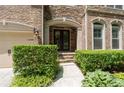 Charming home entrance featuring manicured bushes and a stone walkway at 344 Nottingham Dr, Marietta, GA 30066
