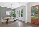 Bright dining room featuring hardwood floors, modern chandelier and natural light at 2602 Drew Valley Ne Rd, Brookhaven, GA 30319