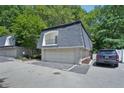 Charming condo featuring a garage, a balcony, and a well-maintained facade at 5490 Chemin De Vie, Sandy Springs, GA 30342