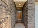 Close up of the front door, showing the brick entryway at 10 Stewart Hollow Ln, Covington, GA 30016