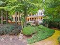 Lovely two-story home with mature trees and a welcoming front porch at 2722 Brookhaven Ln, Buford, GA 30518