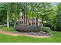 Inviting two-story home with lush landscaping and a covered front porch at 2722 Brookhaven Ln, Buford, GA 30518